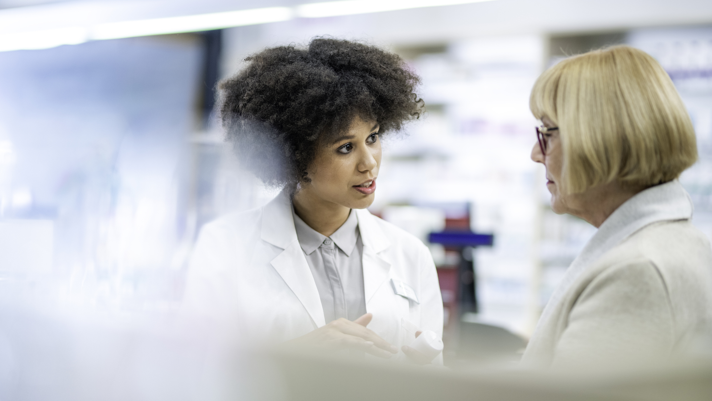 Pharmacist talking with patient